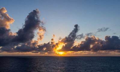 Sunset Over The Ocean with Vibrant Clouds and Radiant Sky