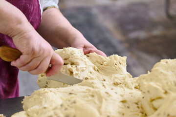Crafting the perfect cracker dough in a rustic kitchen during a sunny afternoon