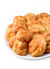 Fresh loaf of breads or buns with cottage cheese on plate isolated on white background. Pastries and bread, top view, close up