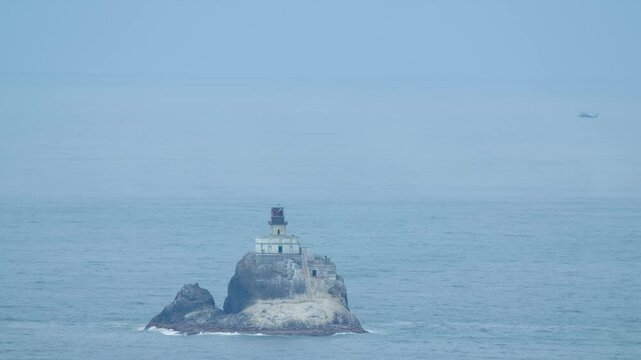 Drone footage shows Tillamook Rock Lighthouse, also known as Terrible Tilly, standing tall on a rugged sea stack off the Oregon Coast.