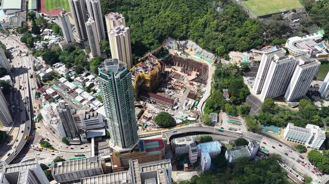 Aerial shots of Hong Kong Kowloon Bay revitalized commercial district, showcasing transformed industrial buildings into modern office towers near Kai Tak and Kwun Tong