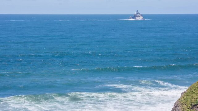 Footage shows Oswald West State Park's rugged coast with its signature rocks, wave patterns, and green backdrops of coastal forest.