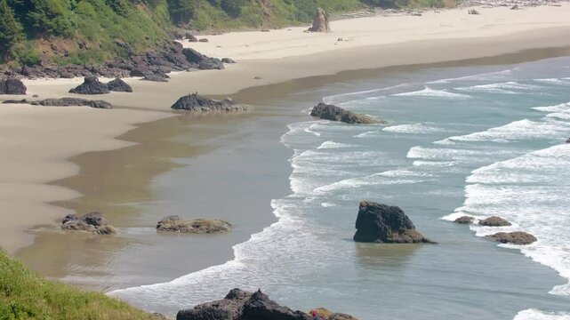 Drone footage captures the rugged coastline and lush coastal forest of Oswald West State Park in Oregon, showcasing nature's raw Pacific beauty.