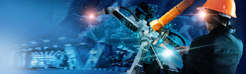 .Industry in the AI Digital Age, Engineer working with automation robotic arms on ai interface,...