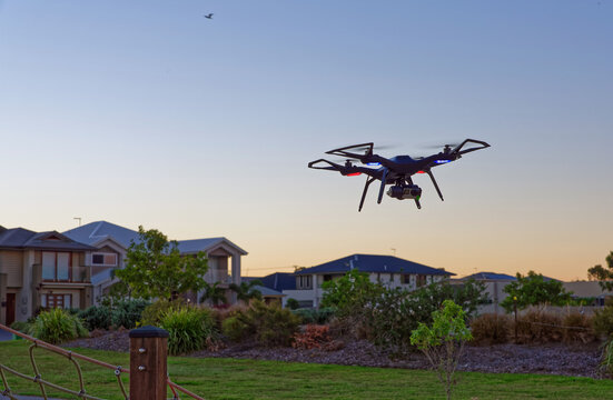 Drone flying at sunset in empty park with copy space