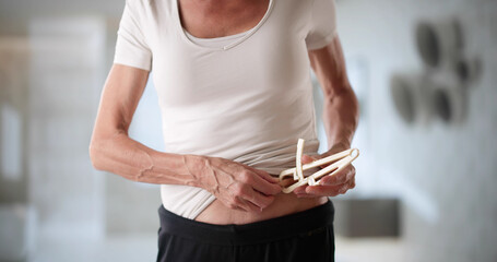 Female Bariatric Nurse Measuring Stomach