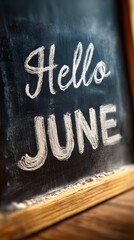 Welcoming the vibrant month of June with open arms, a chalkboard inscription embodies the anticipation of sunny days and fresh beginnings.