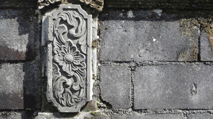 Intricate Stone Carving Detail on Ancient Wall Architectural Ornamentation