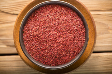 Arabic Cuisine; Dry ground red sumac powder spice. It's a popular spice in the Middle East.