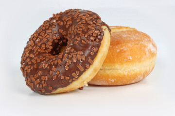 Chocolate donuts and chocolate-filled doughnuts on a white background. A tempting display of sweet bakery treats