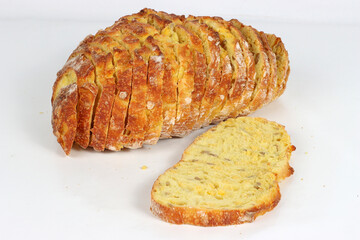 Sliced corn bread isolated on a white background. Golden crust and soft yellow interior