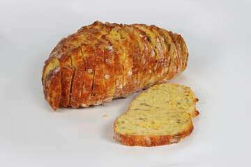 Sliced corn bread isolated on a white background. Golden crust and soft yellow interior