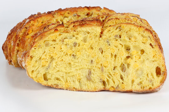 Sliced corn bread isolated on a white background. Golden crust and soft yellow interior