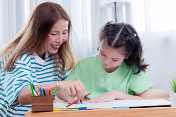 Asian mother and young daughter coloring, playing together bonding relationship family, mom multitasks and child share free time joyful drawing, teaching schoolwork with little girl, homeschool kid