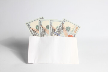 envelope containing dollar bills filled to capacity isolated on white background