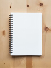 A spiral bound book sitting on top of wooden table.