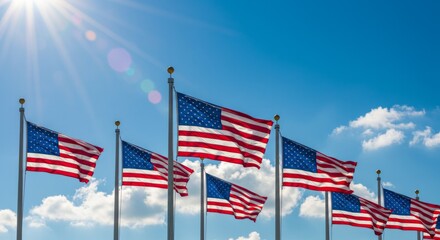 Naklejka premium American flags waving proudly under a bright sky on a sunny day for patriotic celebration