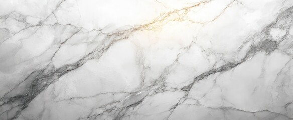 Close-up of white and gray marble surface with natural veining and subtle golden tones giving an elegant and textured appearance