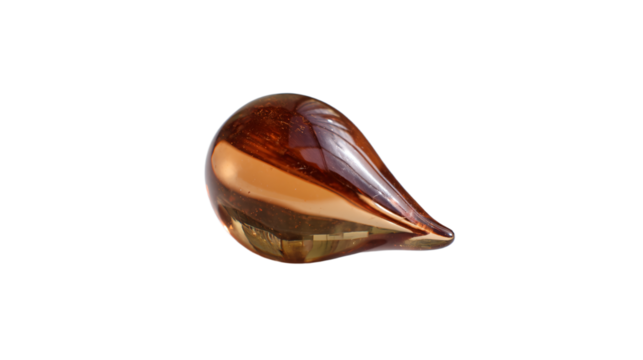 a glass object on a white surface