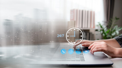 Hands typing on laptop with 24/7 support icon and digital communication elements. Concept of remote work, nonstop service, online business, customer care, and global connectivity.