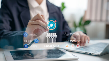 Fototapeta na wymiar Business person working on local SEO strategy with digital marketing icons and location targeting. Concept of online visibility, local search, and small business digital promotion.