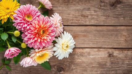 Vibrant bouquet of colorful daisies and dahlias arranged on rustic wooden planks