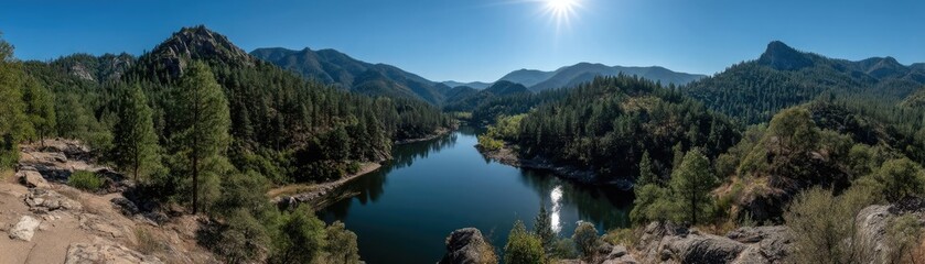 Scenic view of lake in pine forest with cloudy summer sky concept. A serene mountain landscape with a reflective river and clear sky.