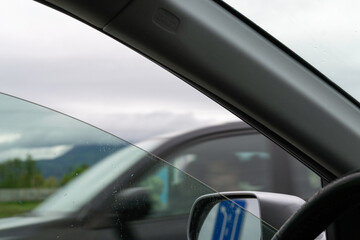 Naklejka premium View from Inside a Car with Passing Vehicle on the Highway