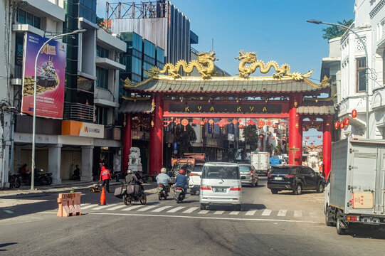 Surabaya, Indonesia - June 20, 2024 : main gate of the kya - kya gate or Chinese Wijk van Soerabaia across the red bridge in surabaya