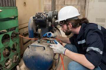 Engineer worker setup, maintain, repair mechanism of operation of air compressor in industry...
