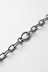 Close-up of a metallic chain link, showcasing its robust construction and interlocking design, a symbol of strength, unity, and connection.