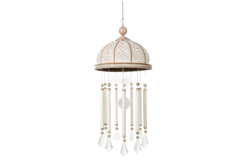 PNG Elegant cream dome wind chime with intricate patterns and tassels