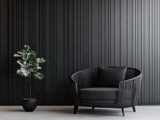 A black chair and plant set against a black panelled wall