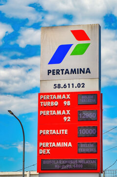 Pertamina gas station price board under blue sky, displaying fuel types PERTAMAX Turbo, PERTALITE, DEX, Indonesia, 8 September 2024.