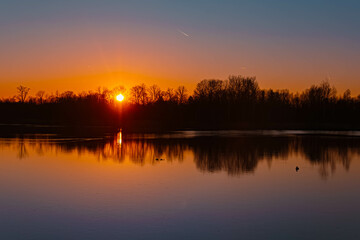 Spring sunset or sundowner with reflections near Niederpoering, Isar, Oberpoering, Deggendorf, Bavaria, Germany