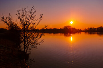Spring sunset or sundowner view with reflections near Plattling, Isar, Deggendorf, Bavaria, Germany