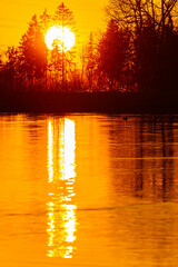 Spring sunset or sundowner view with reflections near Plattling, Isar, Deggendorf, Bavaria, Germany