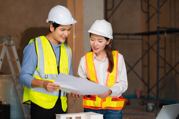 Construction engineers discussion with architects at construction site or building site