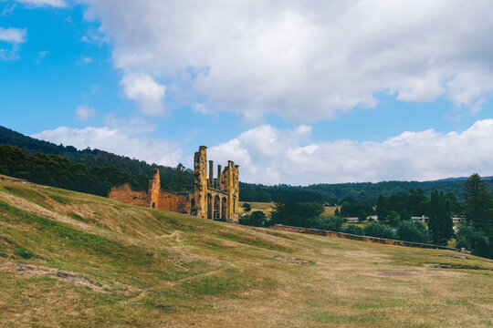 Port Arthur scenic, empty land where houses once stood, with ruins in the background