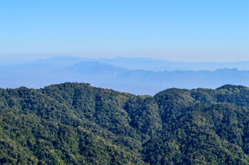 Fototapeta premium Distant Mountains and Forest with Trees and Sky in Northern Thailand.