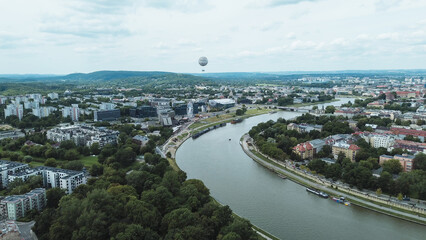 Scenic riverfront with modern structures and trees