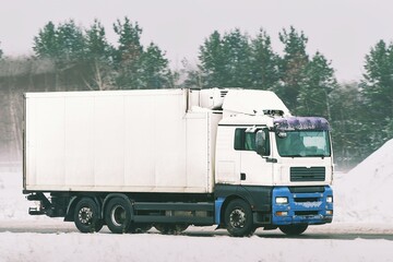 Large cargo truck driving on highway