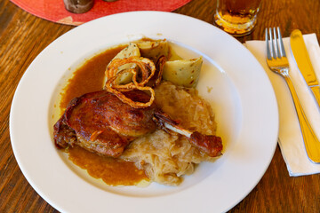 Confit du canard in czech with sauerkraut and potato dumplings. High quality photo