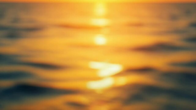 Abstract Blurred golden sea at sunset. Sun reflects on waves with bokeh, illuminating liquid gold of warm sea. Summer ocean nature vertical video. Holiday, vacation and recreation. Weather and climate
