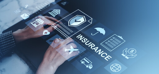 Hands typing on laptop with floating insurance icons and digital interface on a gradient blue background representing online coverage and protection concepts.