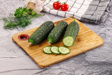 Raw green cucumbers with slices