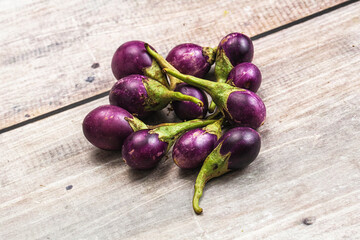 Small organic young purple round eggplant