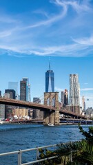 Naklejka premium View of Iconic City Skyline with Significant Bridge Under Bright Sky