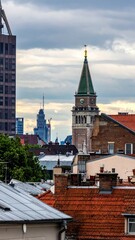 Obraz premium Detailed City Skyline with Focus on Clock Tower and Rooftops