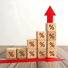 Wooden blocks with percentage signs leading up to a red arrow, concept of interest rate increase